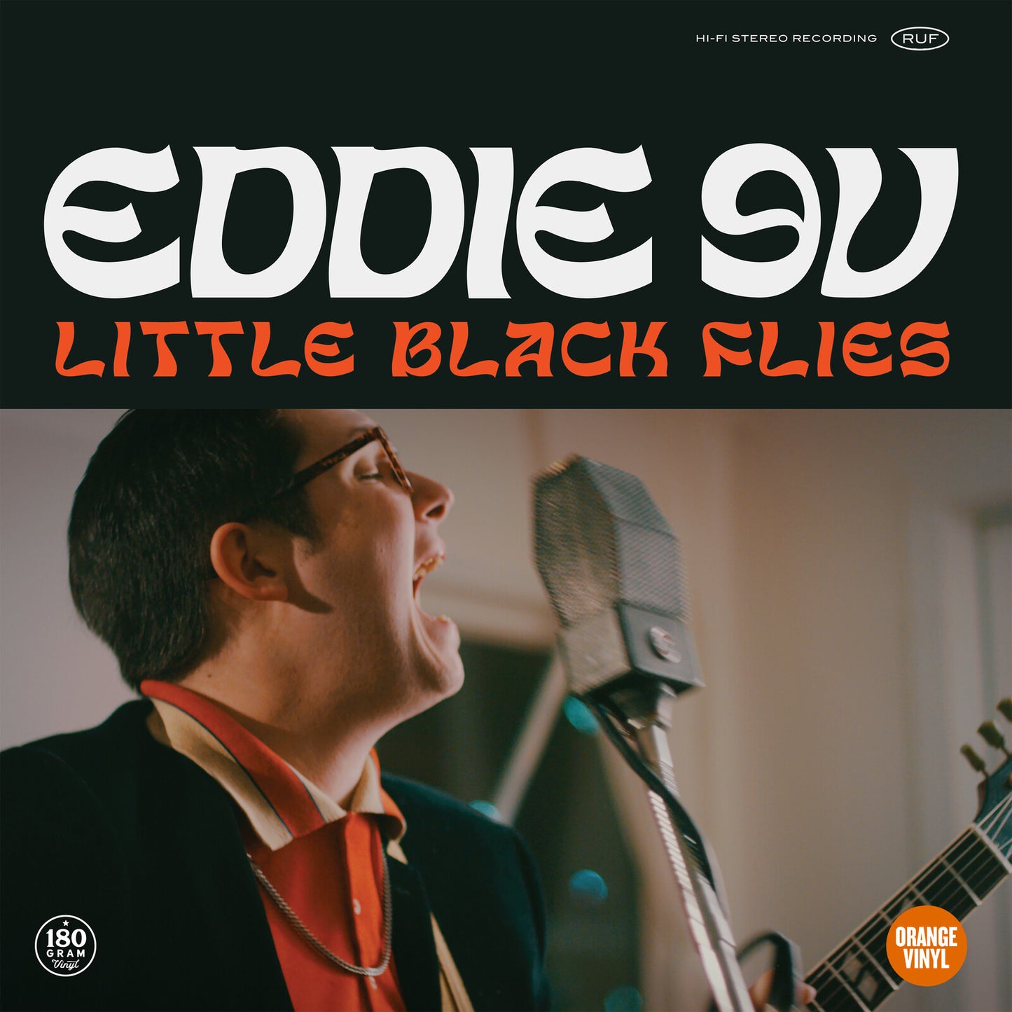 Eddie 9V album cover featuring a man singing into a microphone.
