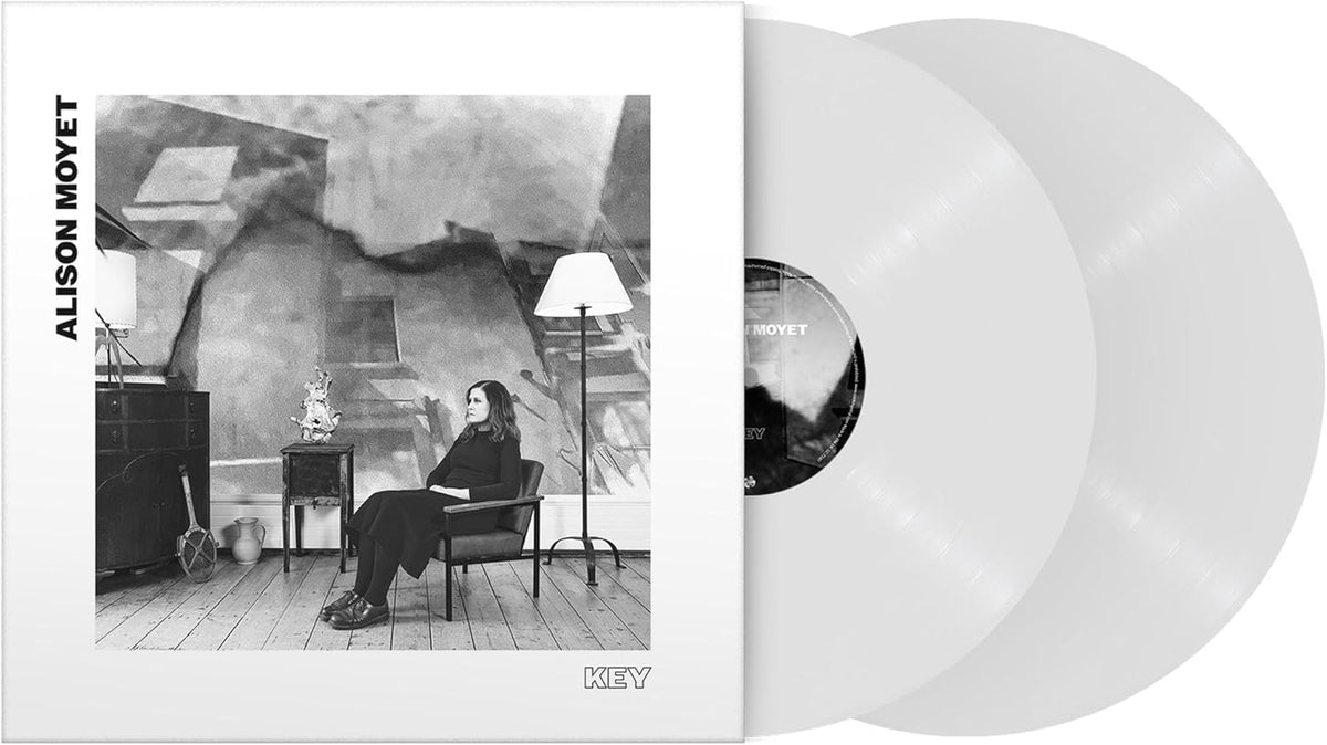 Alison Moyet's "Key" vinyl record with a woman seated in a room.