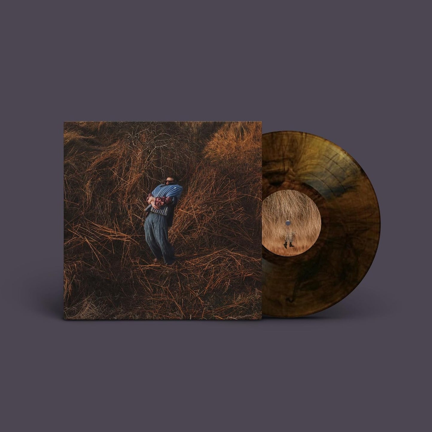 Jack Garratt's "Pillars" vinyl record with marbled honey-colored disc and cover art.