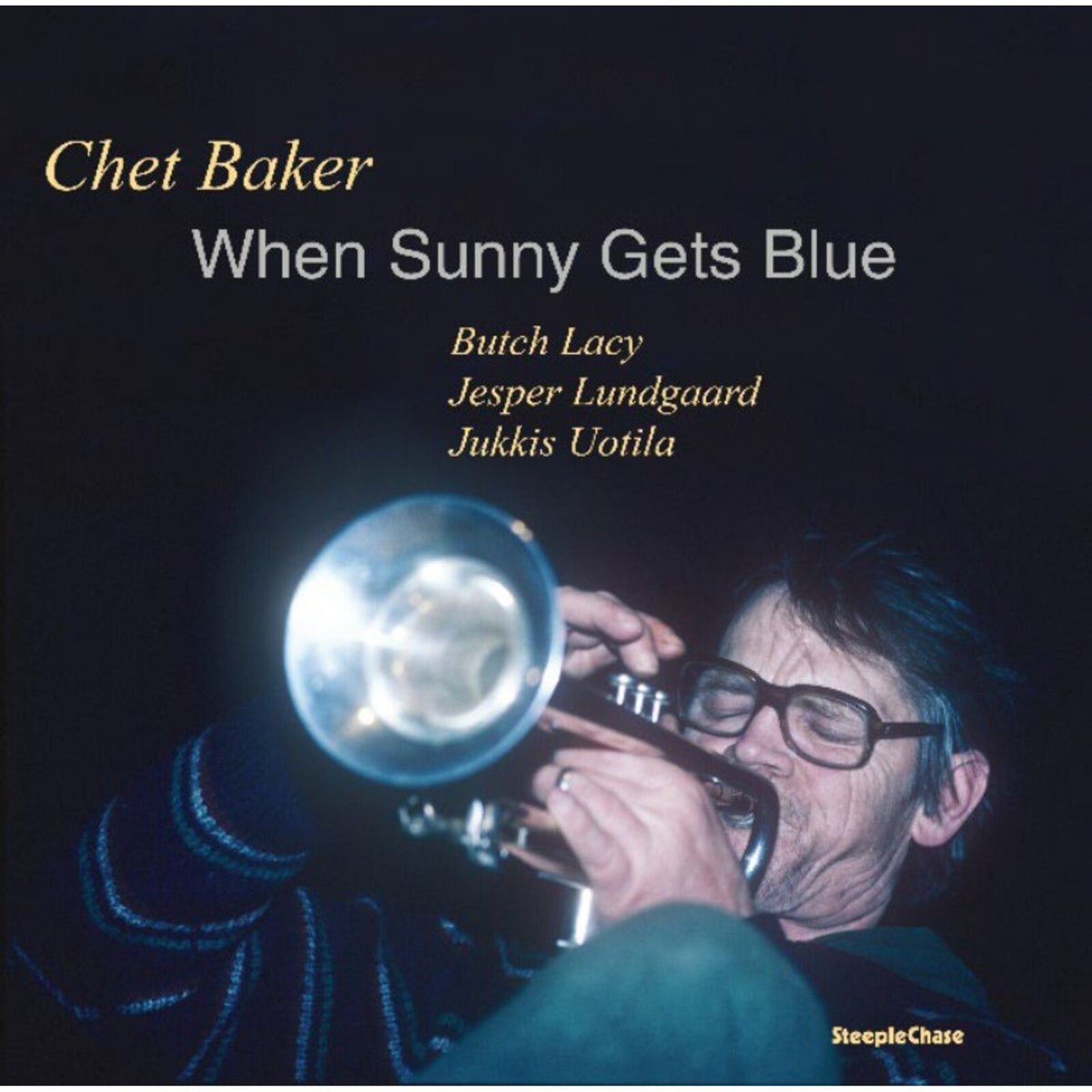 Chet Baker album cover: a trumpet, dark background, and musician portrait.