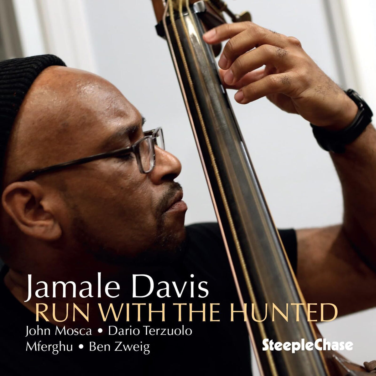 Jamale Davis playing the contrabass, album cover for "Run With The Hunted.