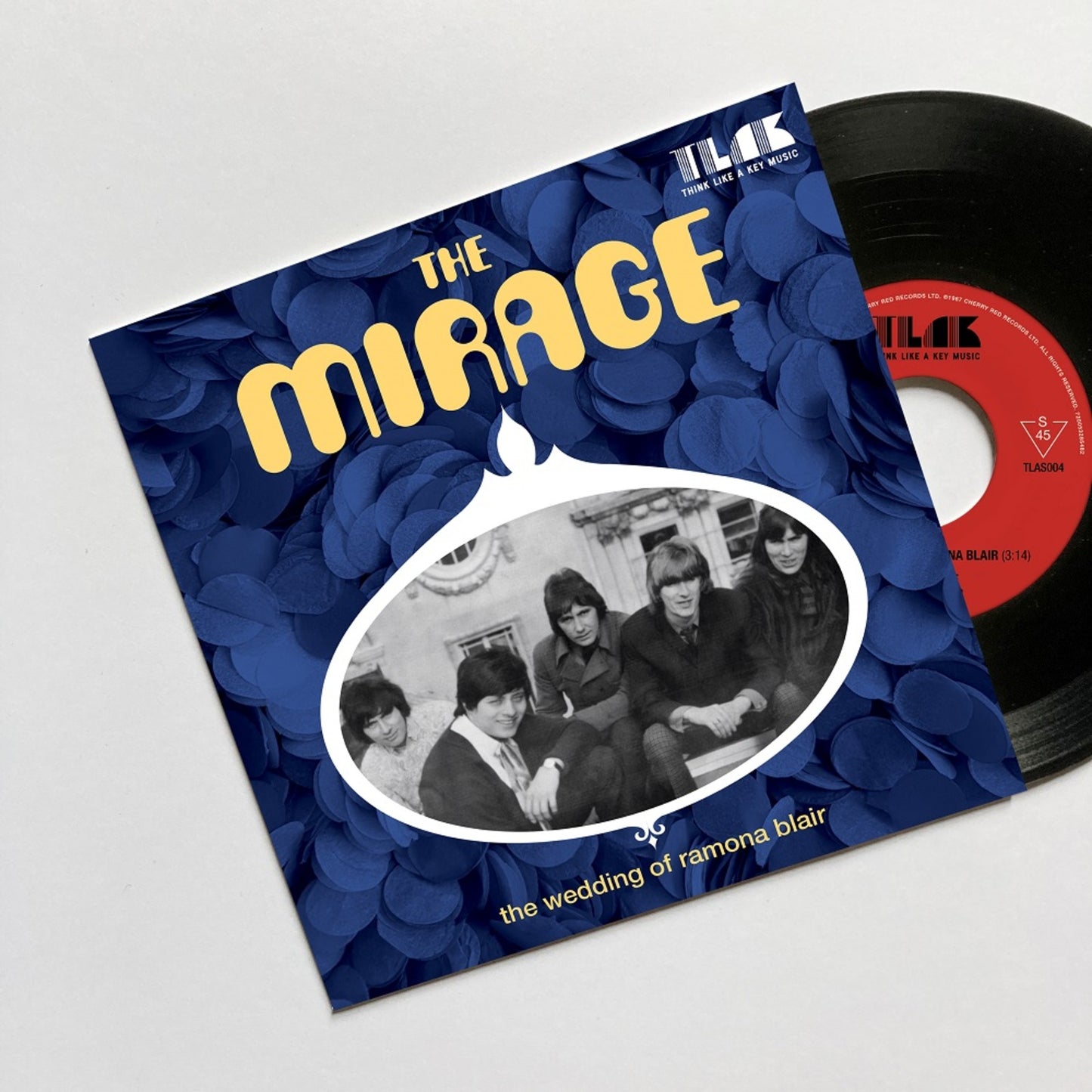 Vinyl record cover featuring a black and white photo of four people.