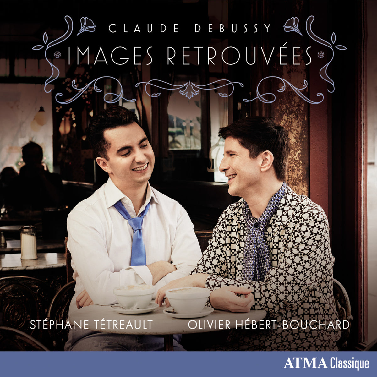 CD cover: two smiling men at a cafe, ornate title text.