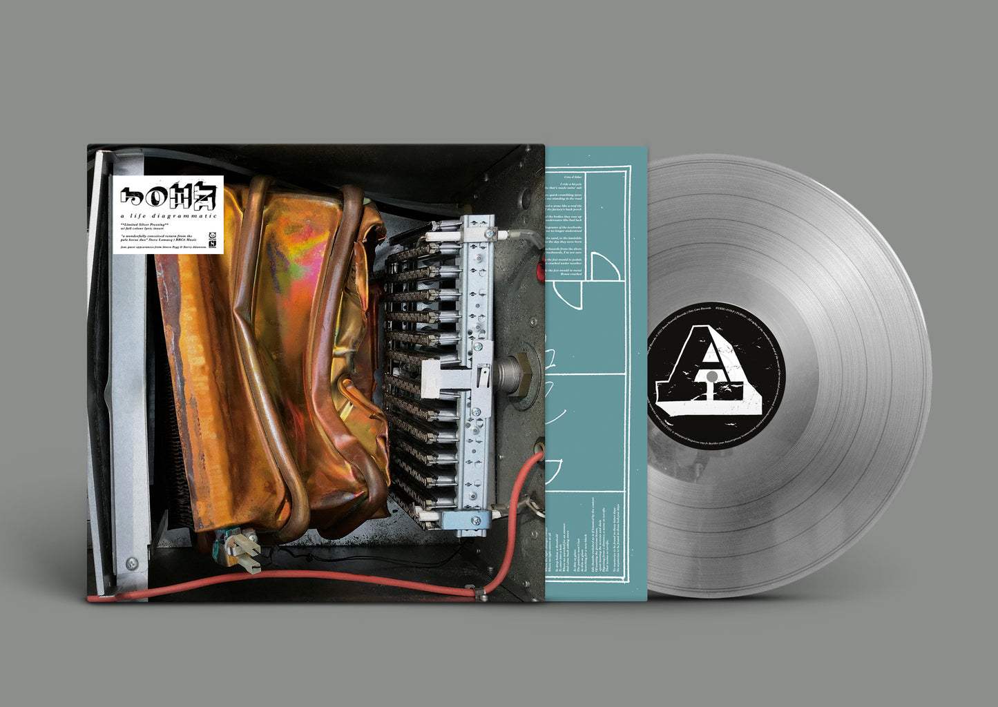 Vinyl record with cover art featuring a mechanical hand and abstract design.