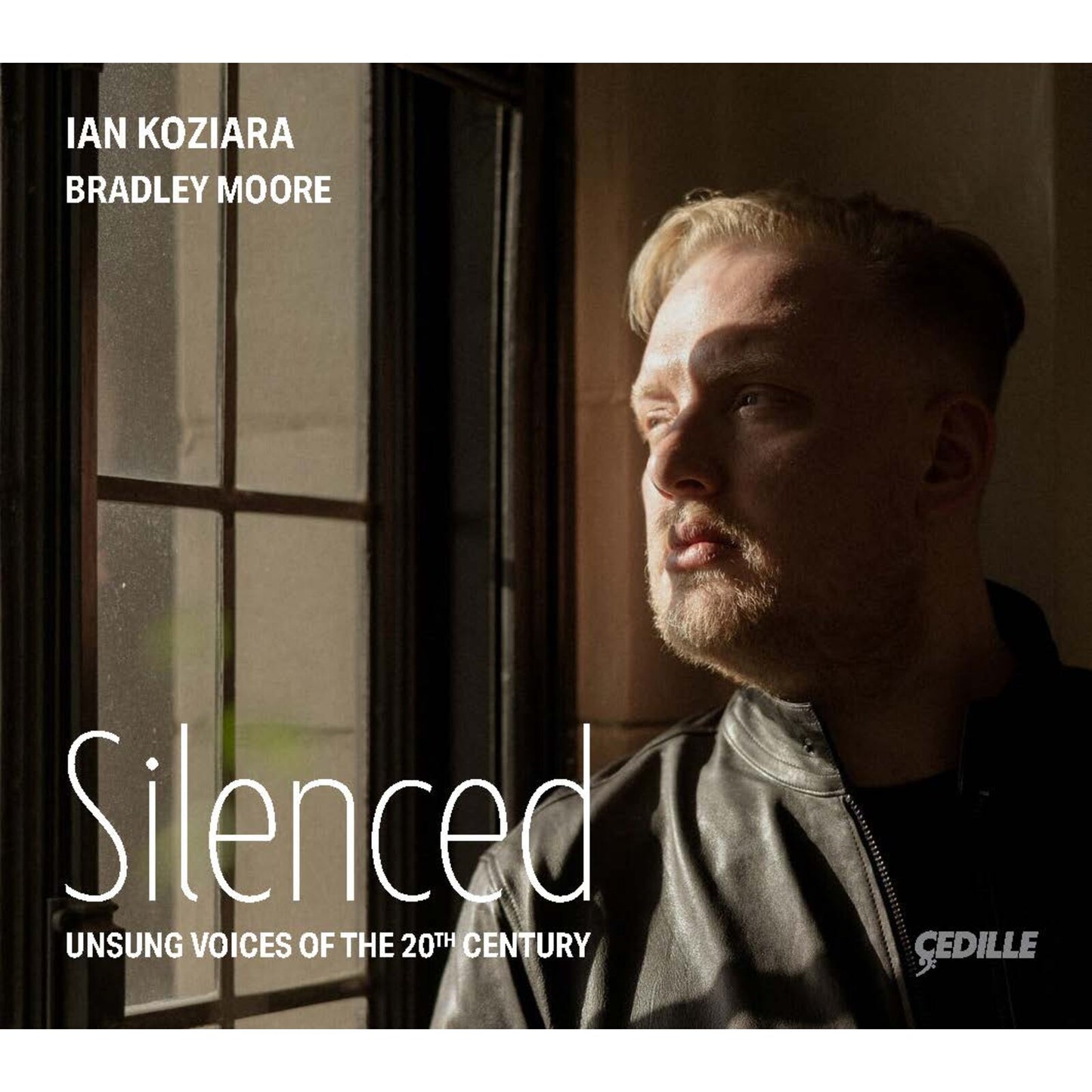 CD cover: portrait of a man looking upwards, text "Silenced.