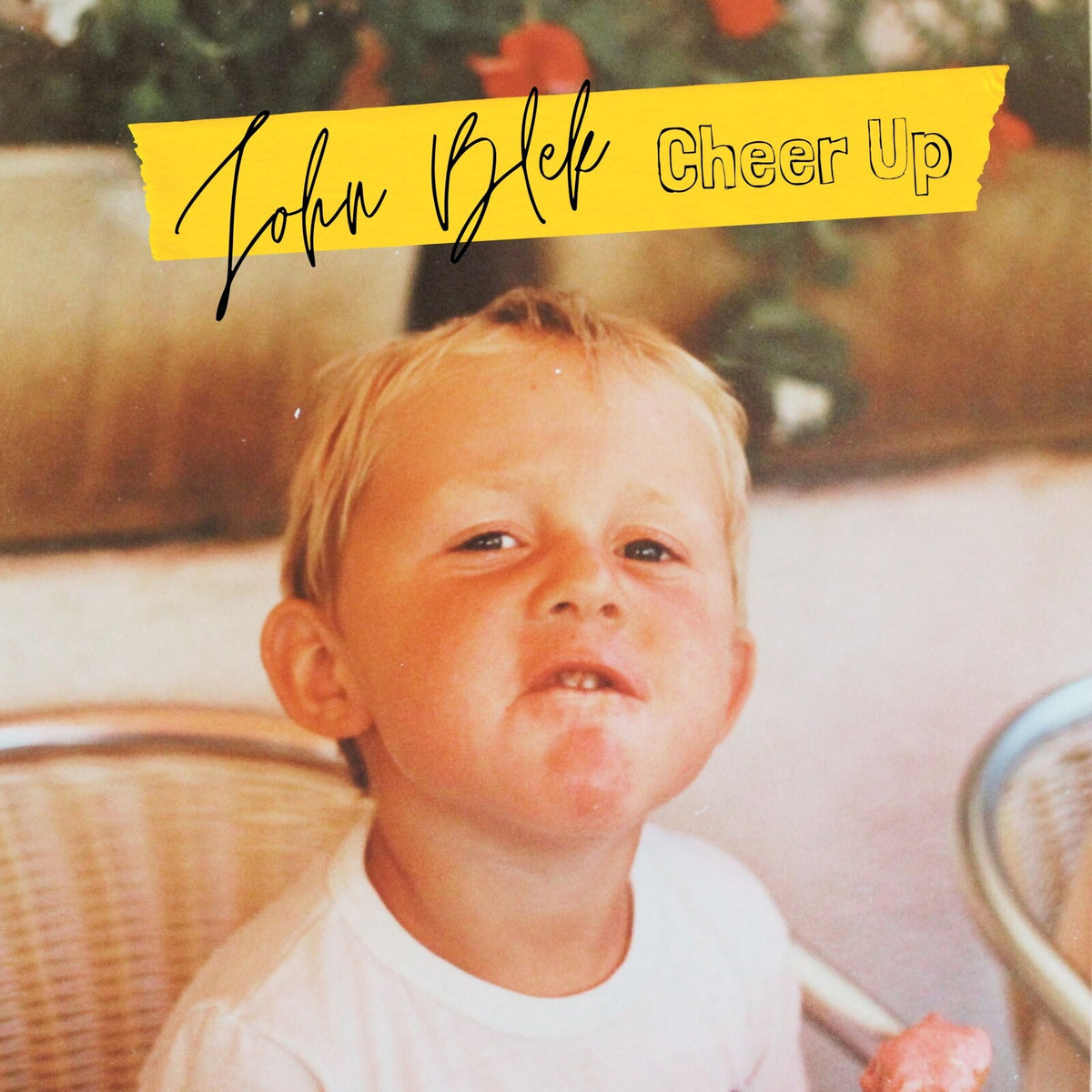 Album cover featuring a childhood photo and handwritten text.