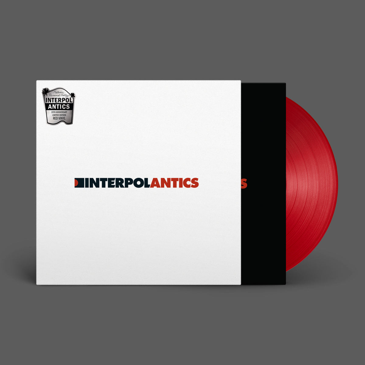 Red vinyl record of Interpol’s “Antics” album in a white sleeve.