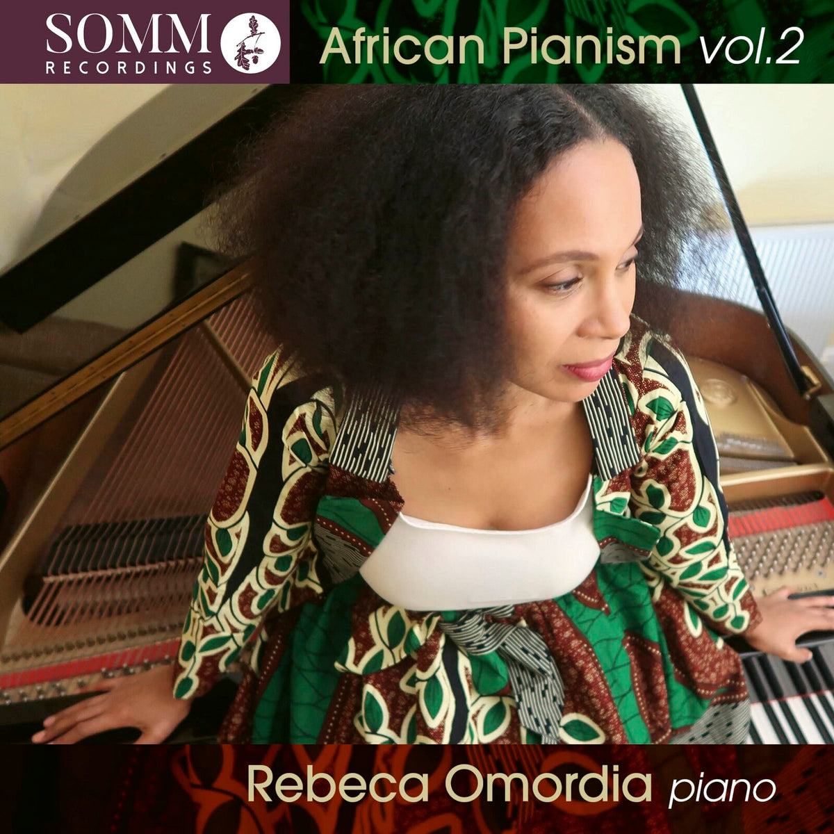 CD cover featuring pianist Rebeca Omordia at a grand piano.