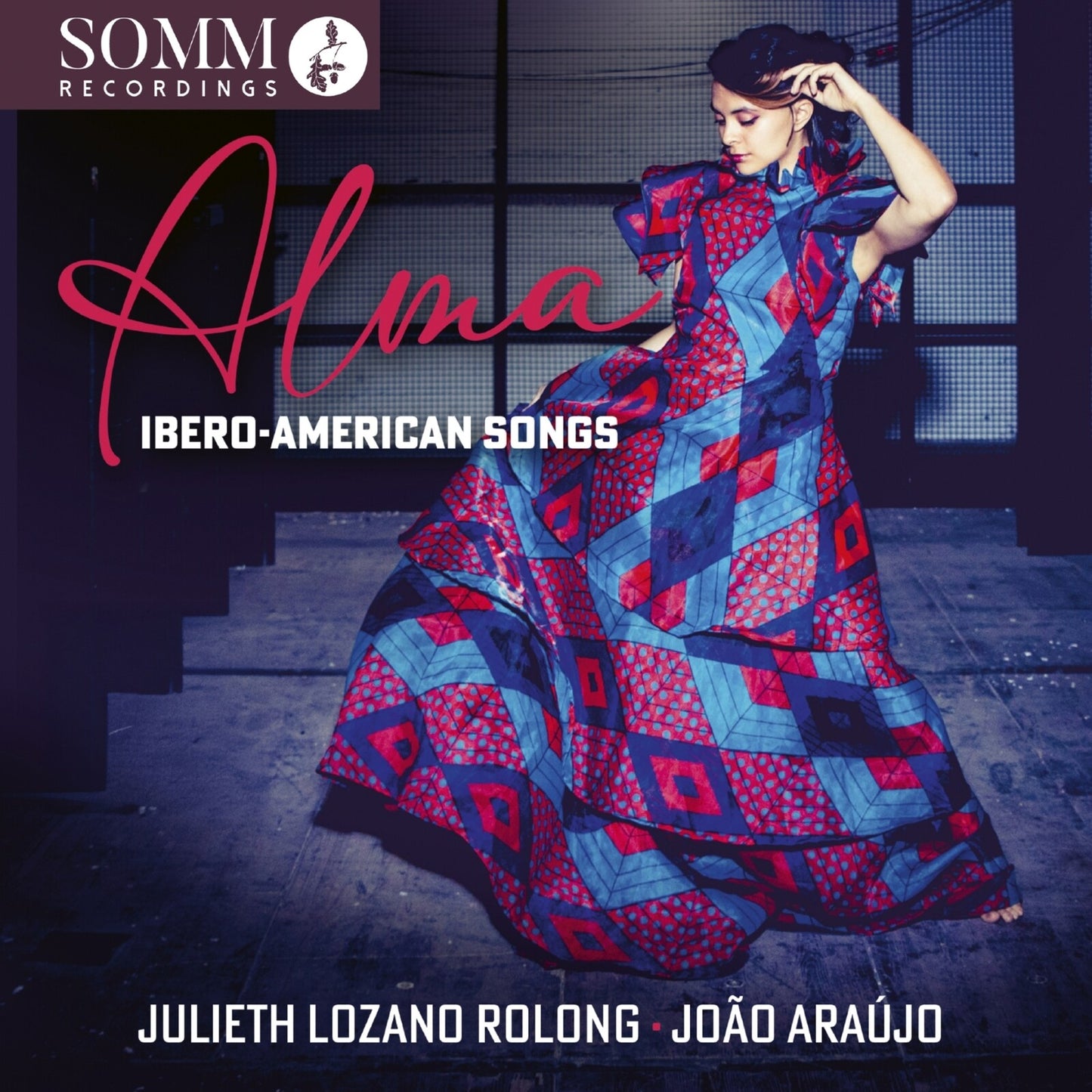 CD cover featuring a woman in a patterned dress, text “Alma” and artist names.