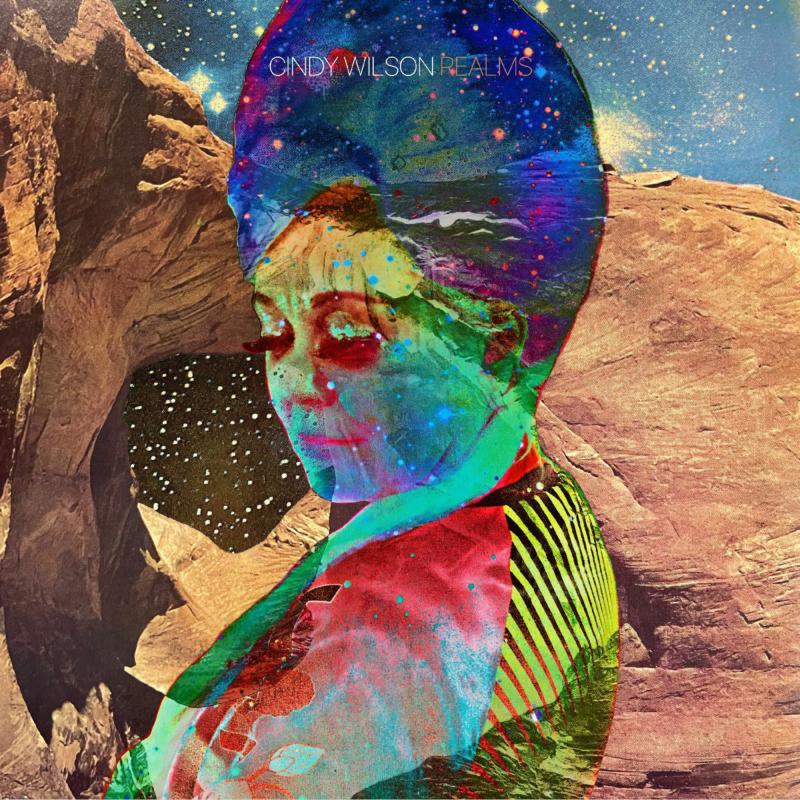 CD cover for Cindy Wilson’s “Realms” featuring a colorful, surreal portrait.