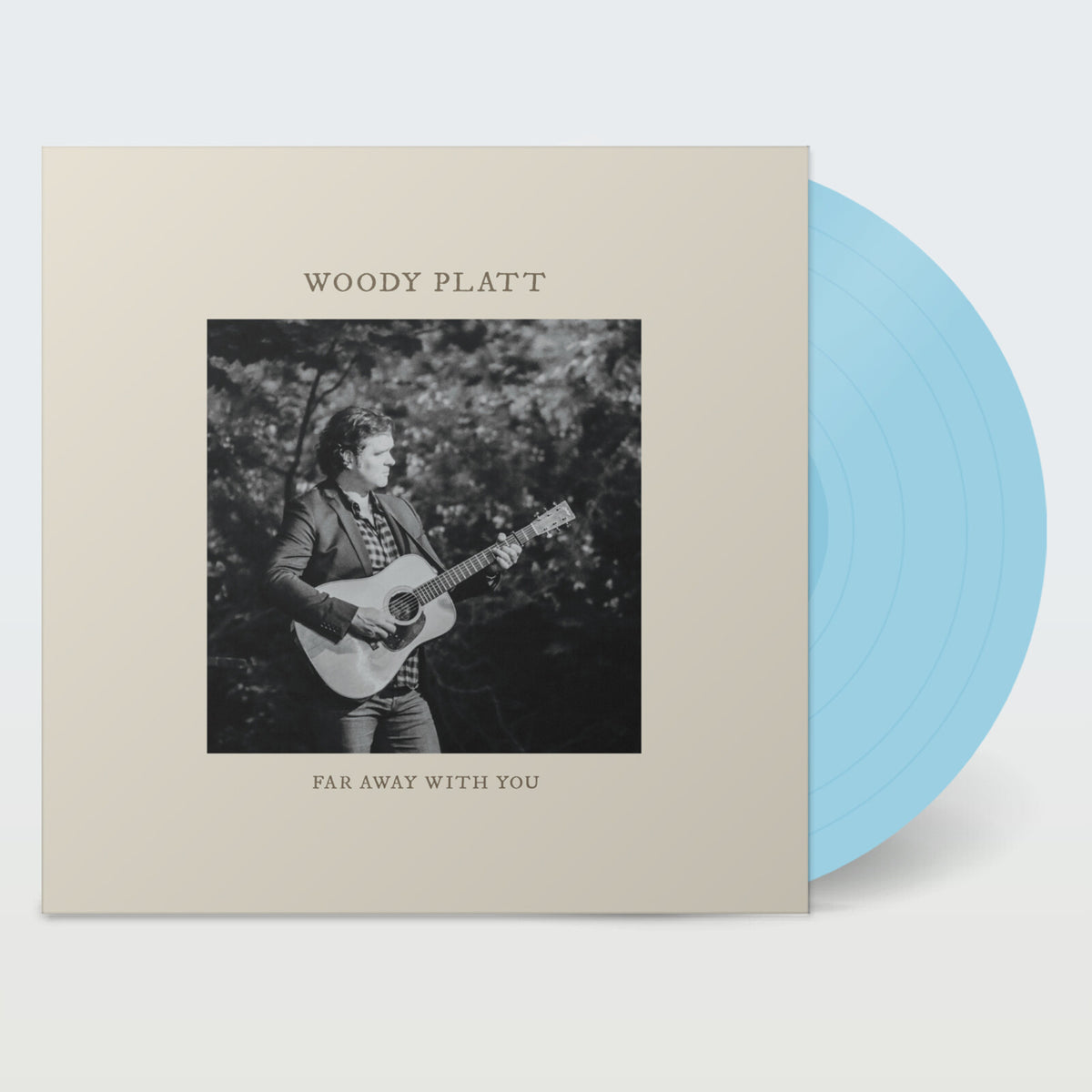 Vinyl record with album cover featuring a musician playing guitar.