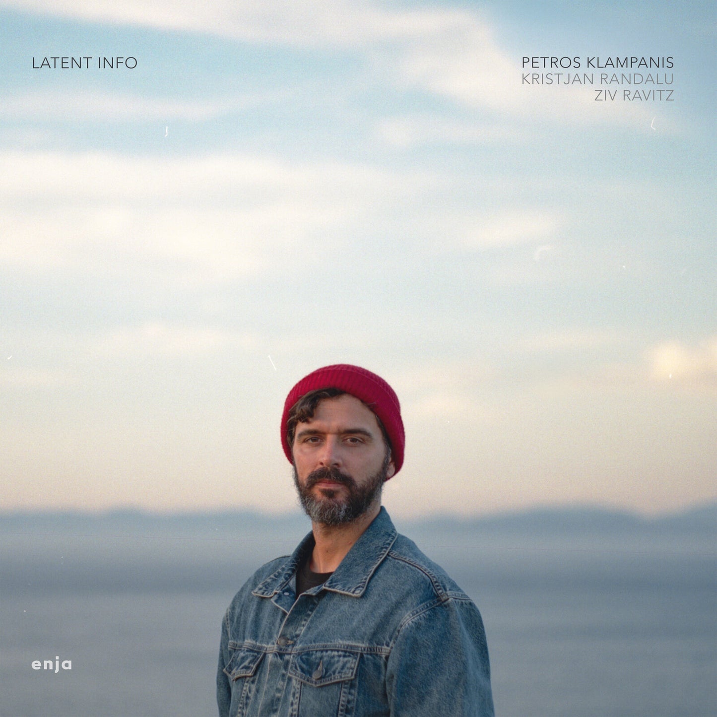 CD cover: man in red hat against a blurred seascape.