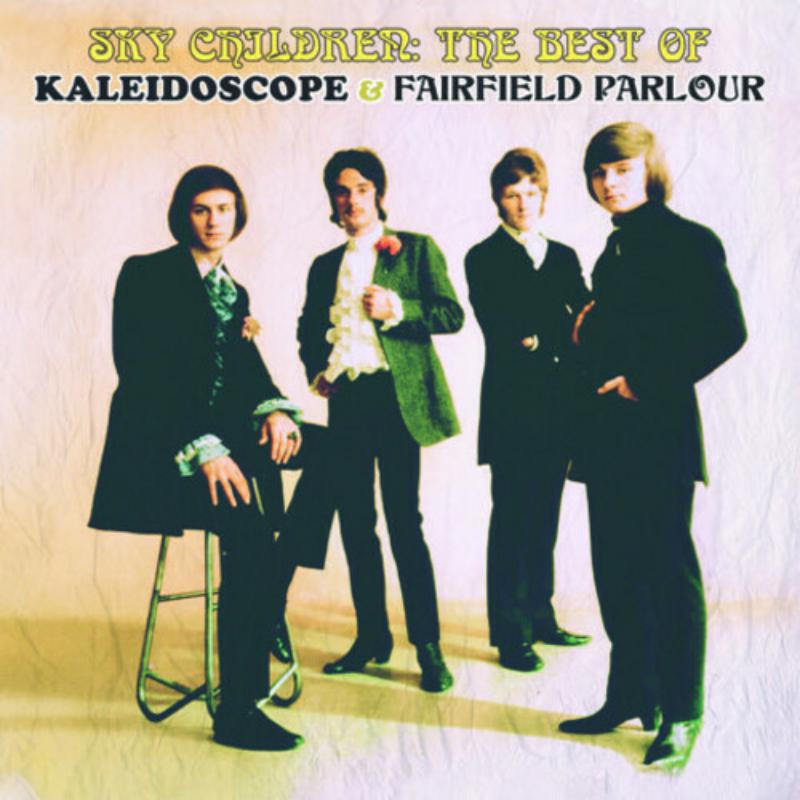 Four men in 1960s suits pose against a light background on this music album.
