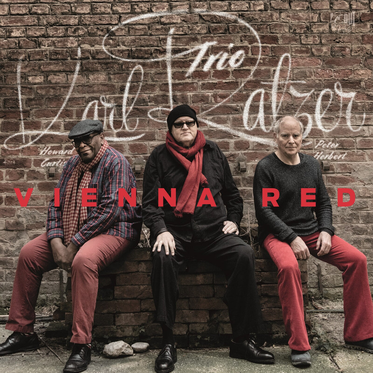 Album cover: Karl Ratzer Trio, three men seated against a brick wall.