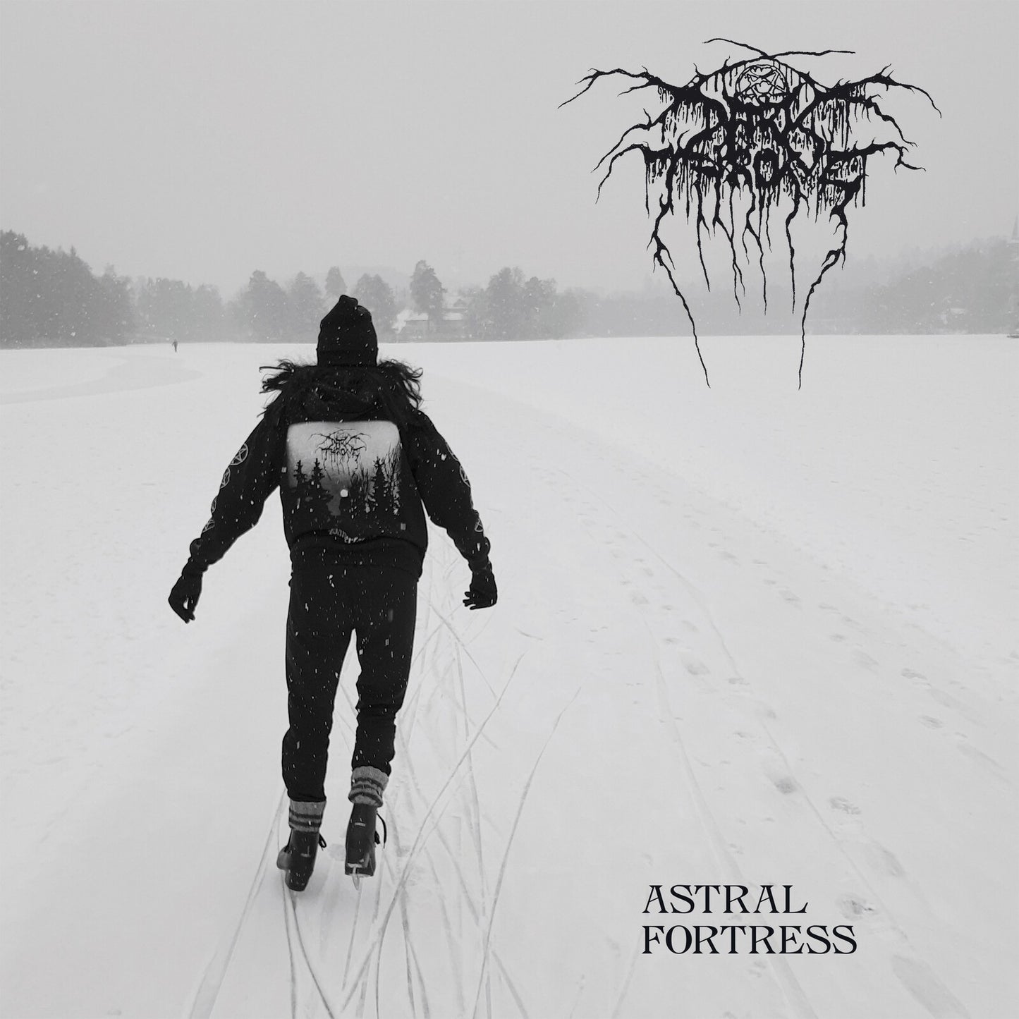 Person ice skating on a frozen lake in winter with Darkthrone logo and text.