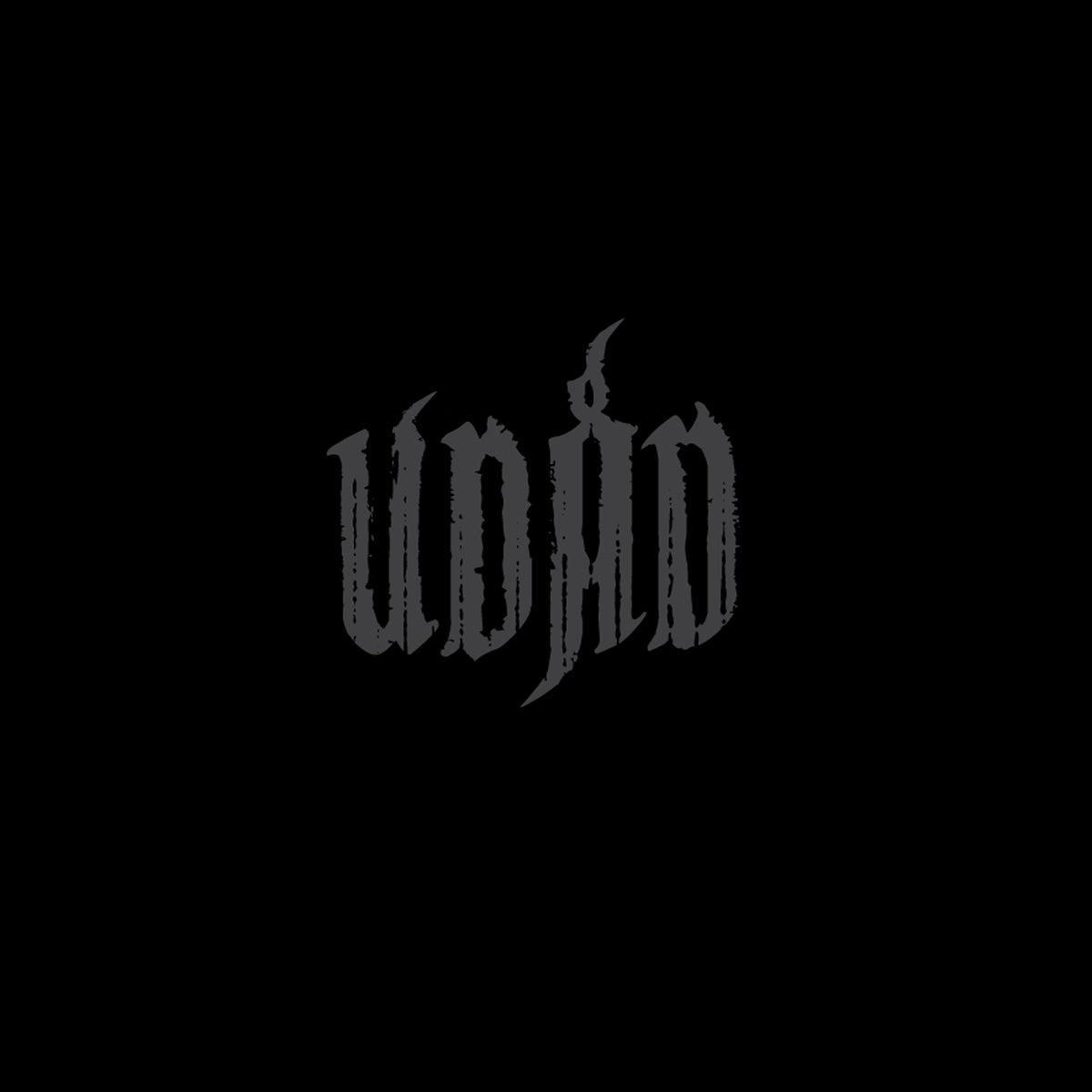 Black text reading "udad" in an ornate, gothic-style font on black background.