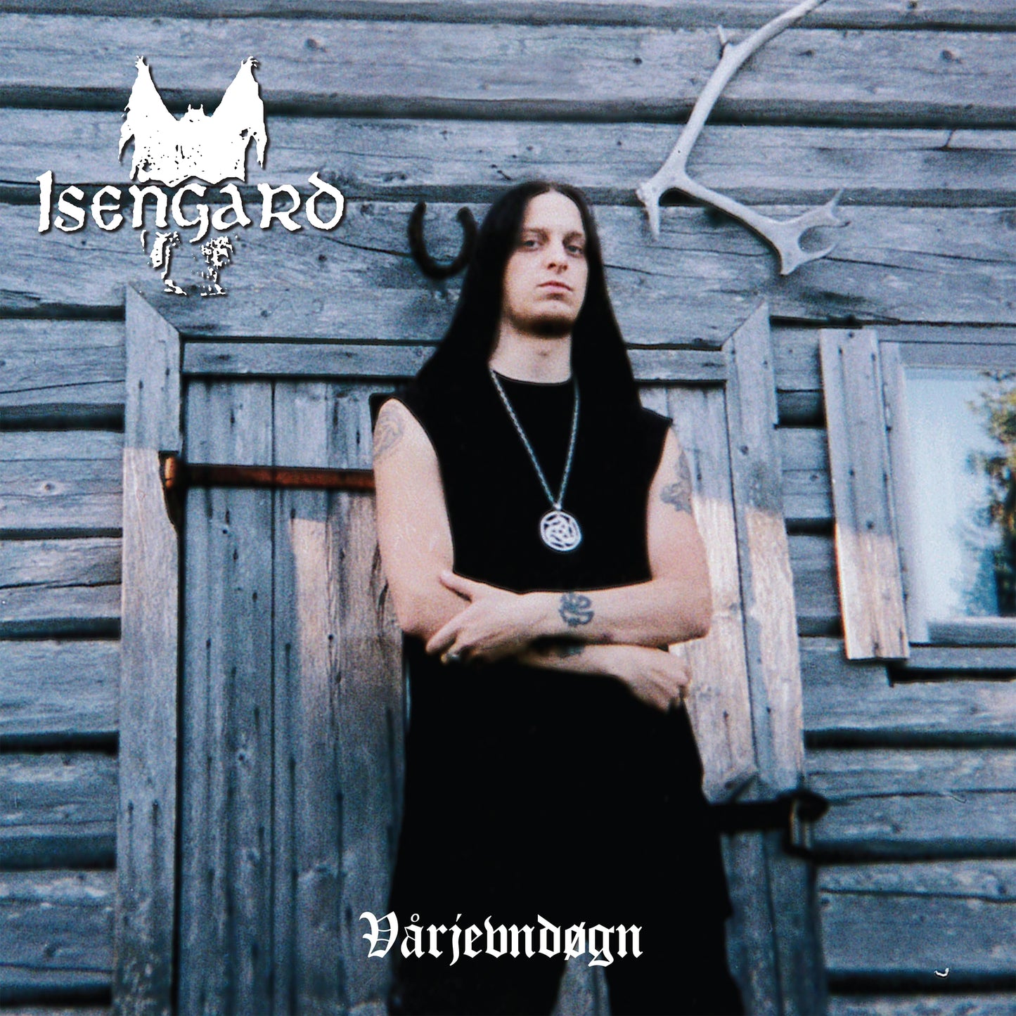 CD cover for Isengard’s “Varjevndogn” featuring a man in front of wood siding.