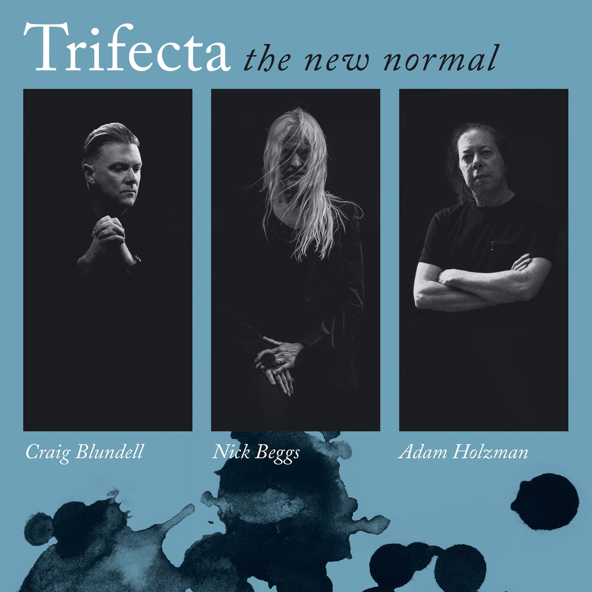 Black and white album cover featuring three men and abstract ink blots.