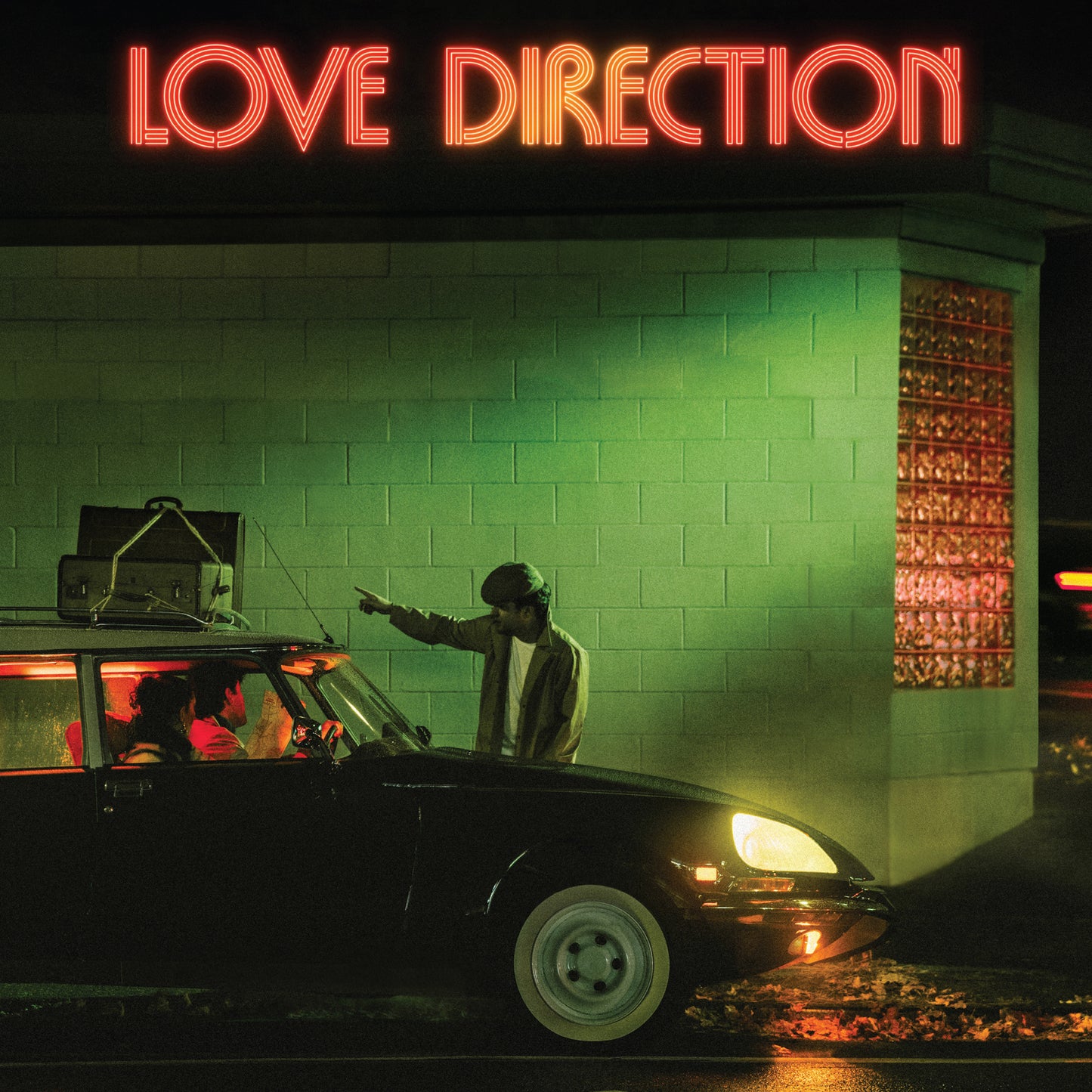 CD cover for The Dip’s “Love Direction” featuring a car and figure.