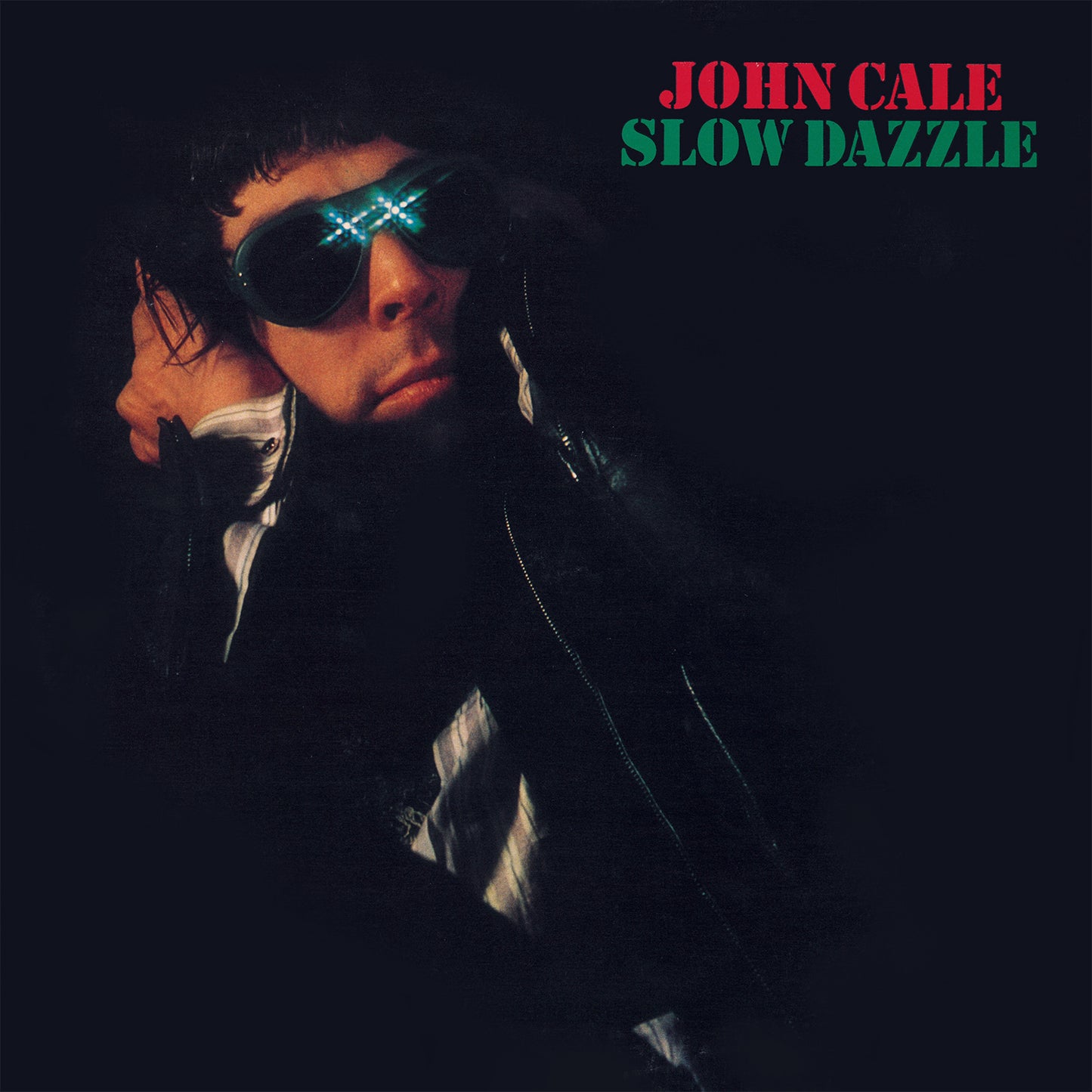 John Cale’s “Slow Dazzle” vinyl album cover with a portrait of the artist.