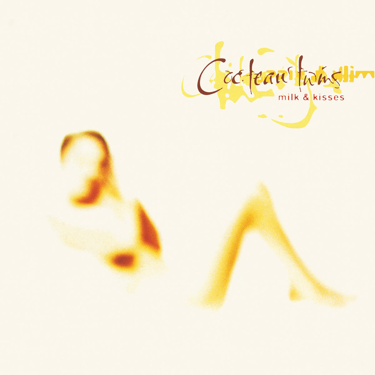 Cocteau Twins’ “Milk & Kisses” vinyl album cover, abstract yellow and orange design.