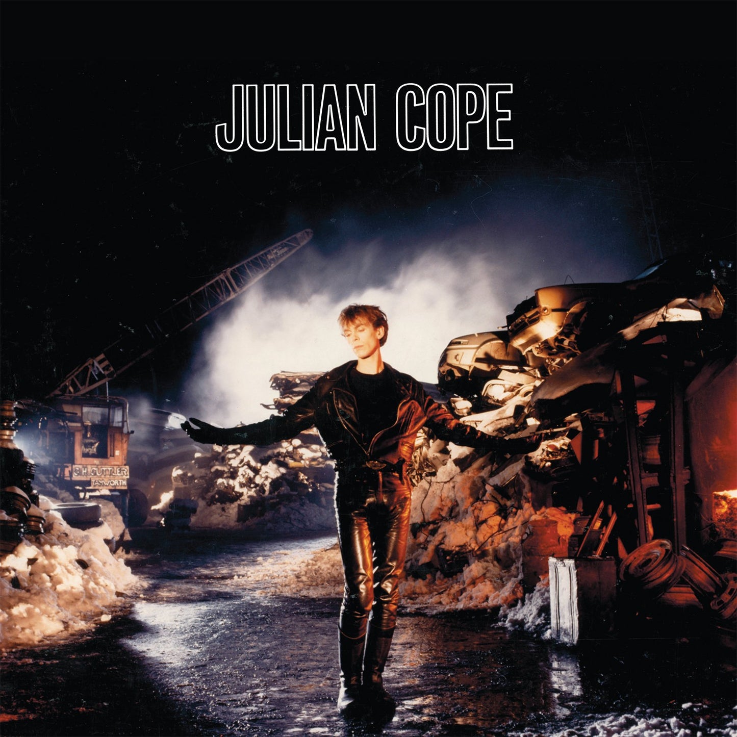 Album cover for Julian Cope’s “Saint Julian” featuring a man amidst wreckage.