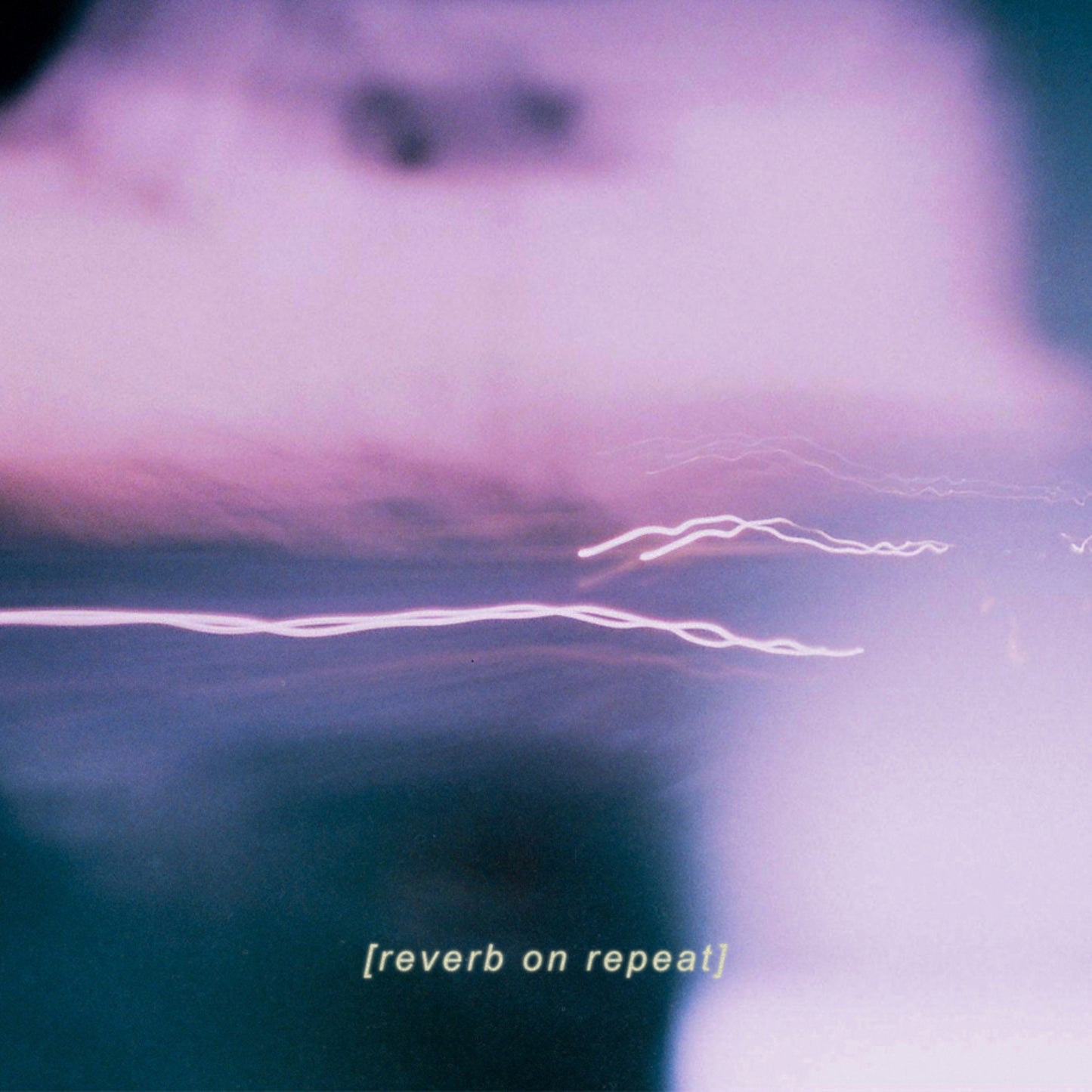 Abstract purple and blue album cover with light streaks and text.