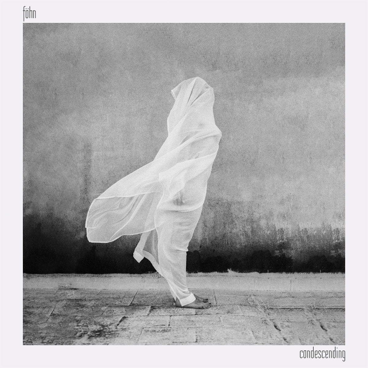 Black and white album cover featuring a figure draped in sheer fabric.