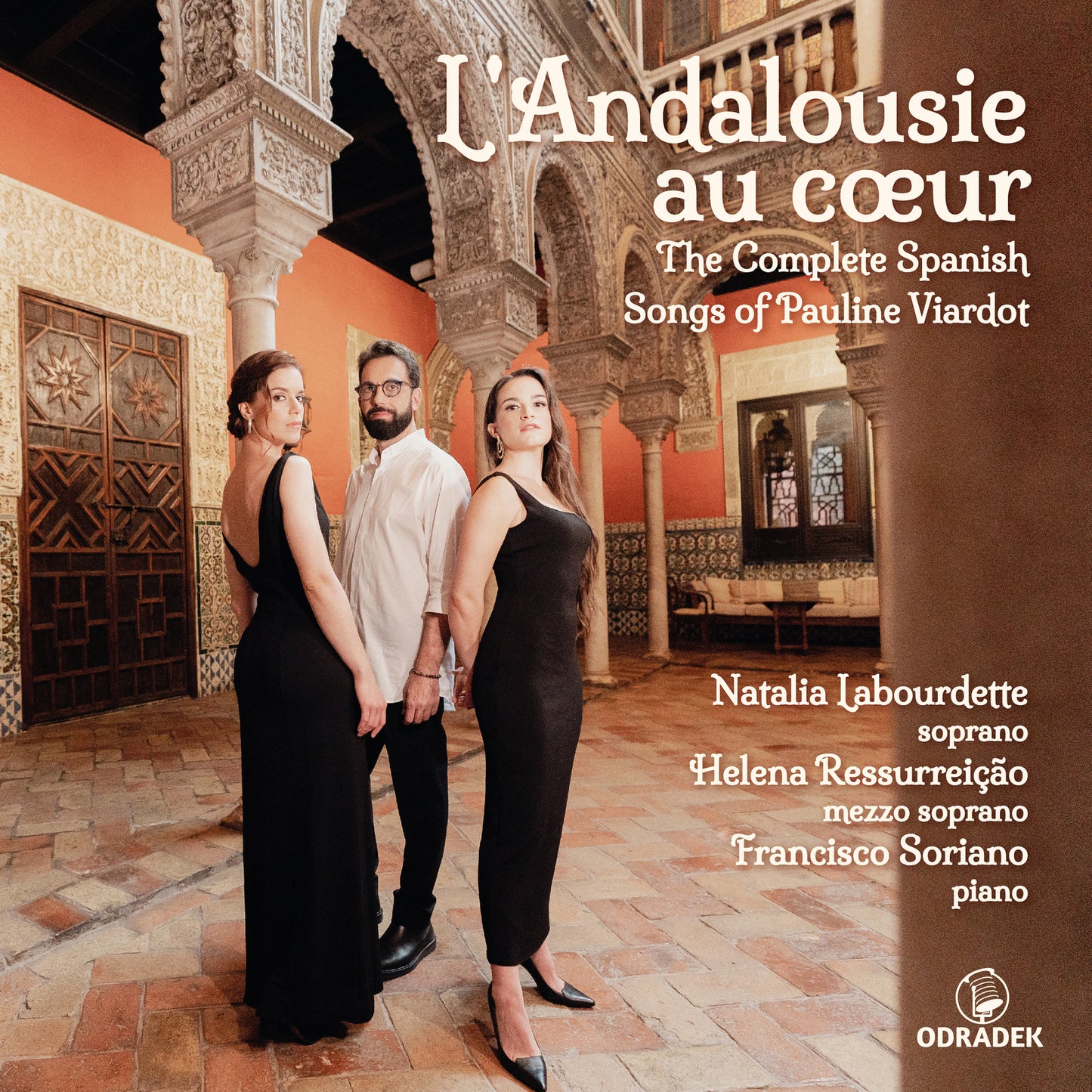 CD cover featuring three people in front of ornate Spanish architecture.