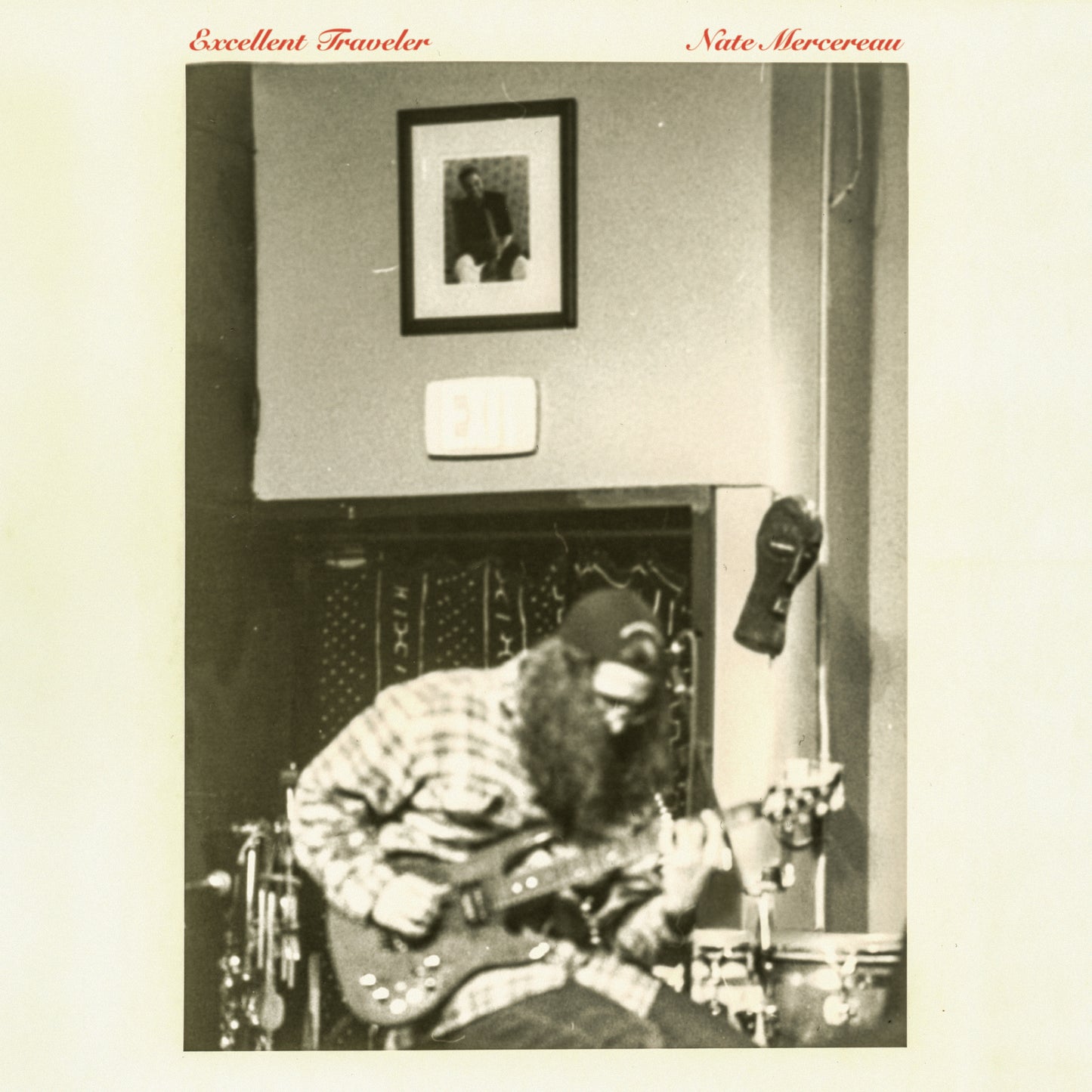 Sepia-toned album cover featuring a musician playing guitar indoors.