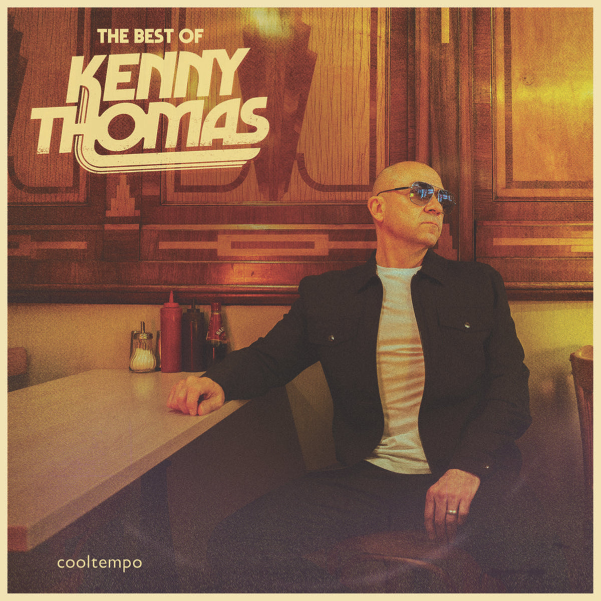 CD cover for Kenny Thomas’ “The Best Of” featuring a man in sunglasses.