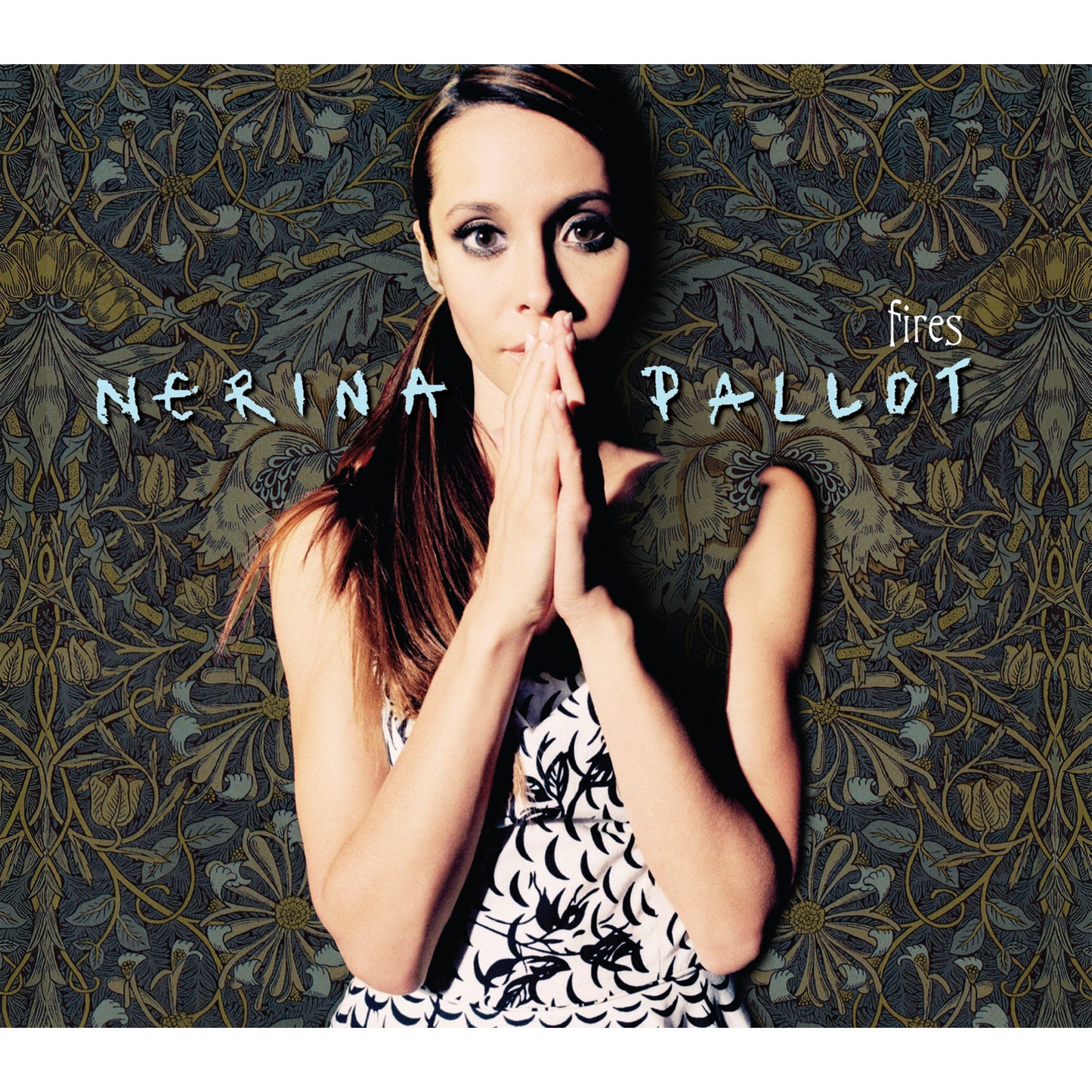 Nerina Pallot album cover with artist portrait and floral background.