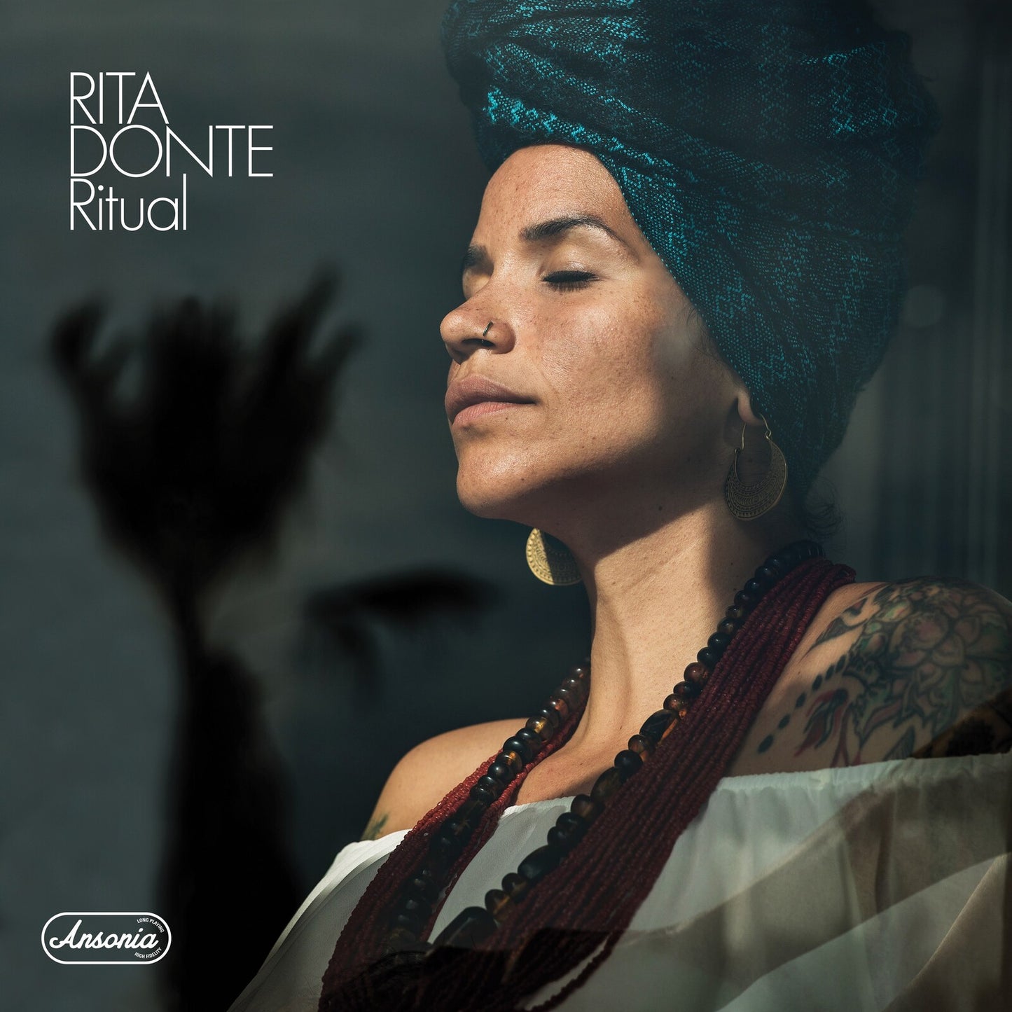 Album cover for Rita Donte’s “Ritual” featuring a portrait of a woman.
