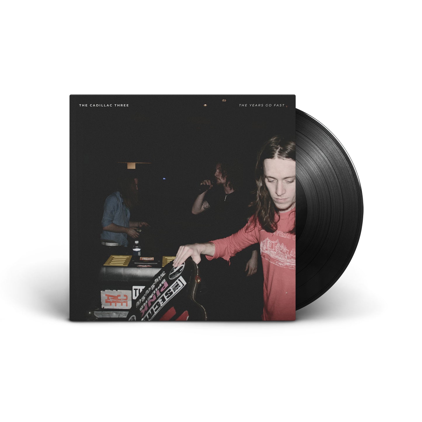Vinyl record cover showing The Cadillac Three band members in a dimly lit room.