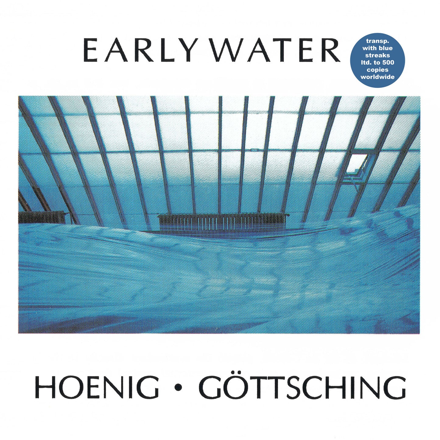 Album cover showing a blue draped fabric beneath a greenhouse-style glass roof structure.