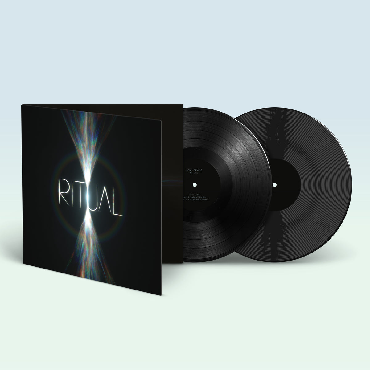 Jon Hopkins' "Ritual" vinyl record with black sleeves and records.