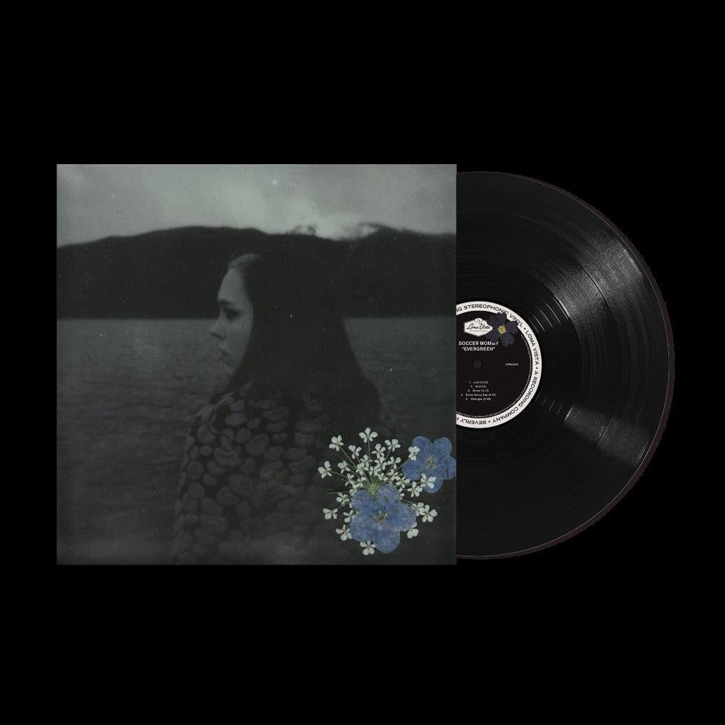 Soccer Mommy's "Evergreen" vinyl record with a portrait cover and blue flowers.