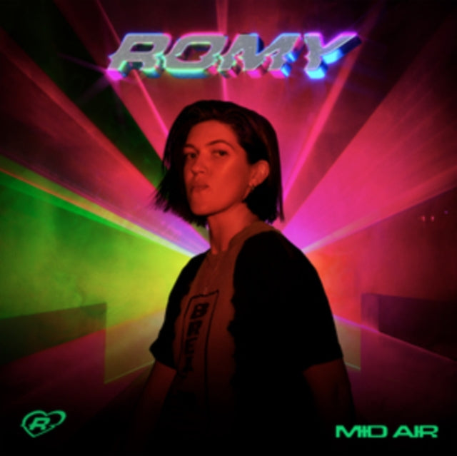 Portrait of Romy with neon pink and green light streaks.