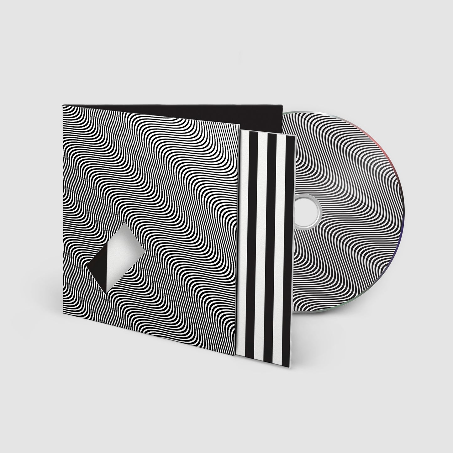 Jamie xx “In Waves” CD case with optical illusion cover art.