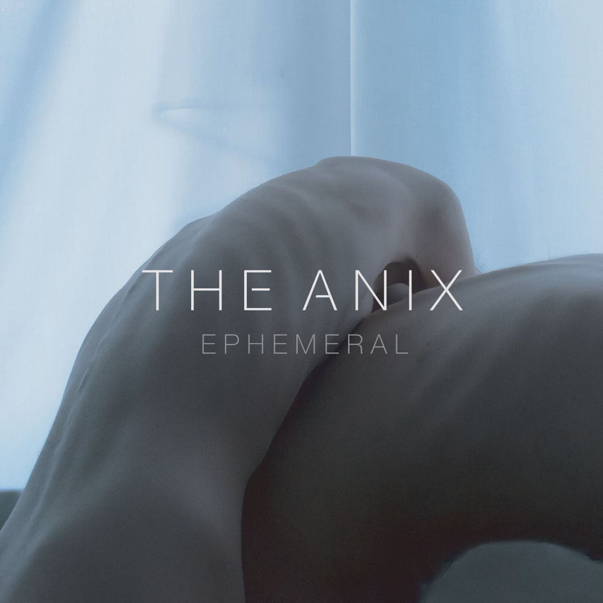 Album cover for "ANIX - EPHEMERAL" featuring a blurred, shadowed figure.