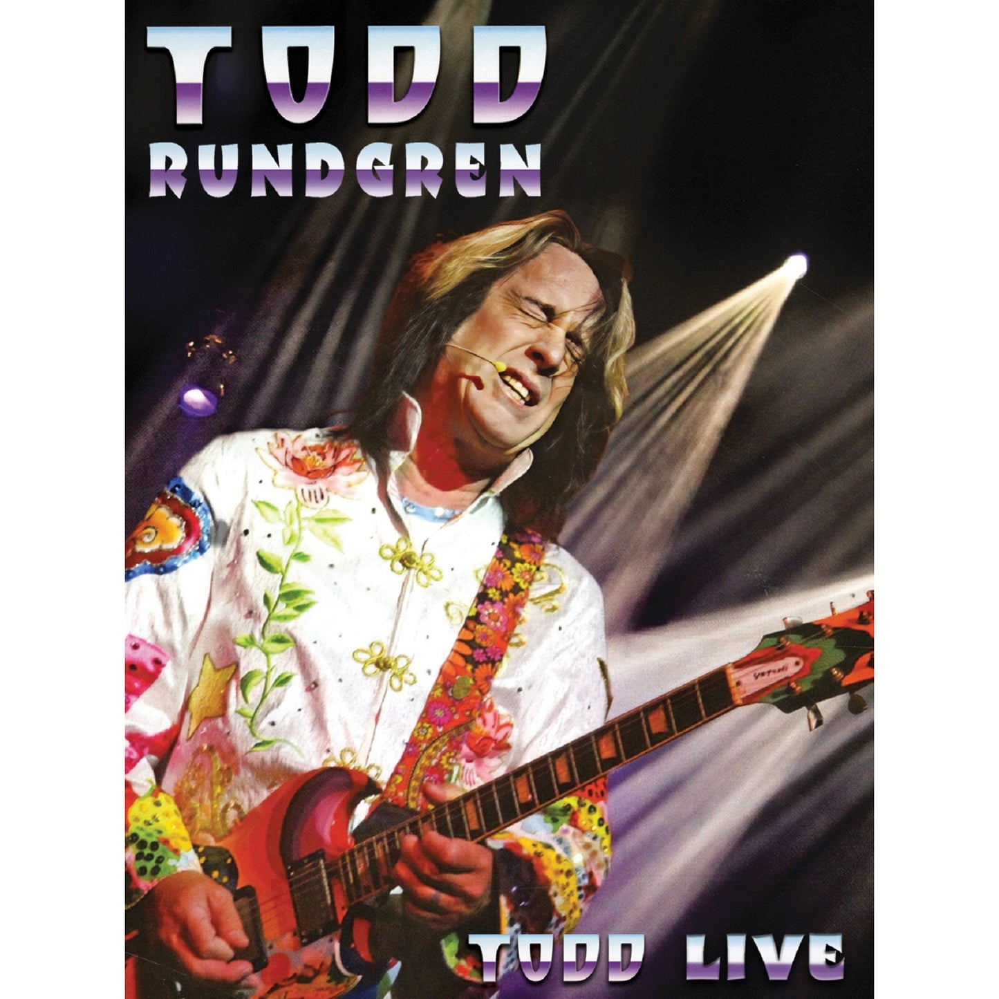 Todd Rundgren playing a guitar on stage, album cover art.