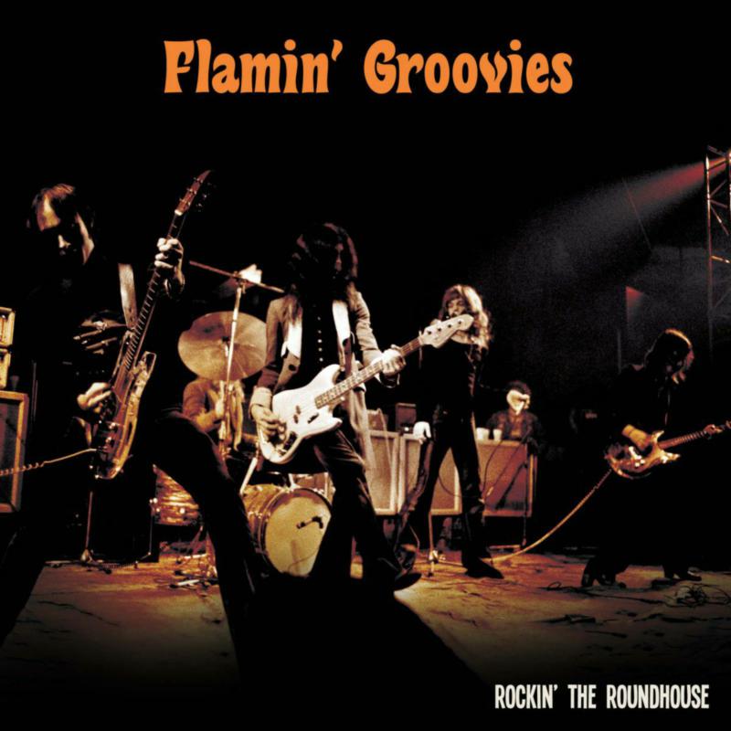 The Flamin' Groovies band performing on a dark stage, CD cover.