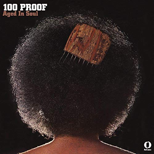 Album cover: Afro hairstyle with a wooden comb, dark background.