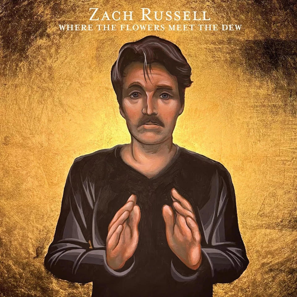CD cover featuring a portrait of musician Zach Russell in gold tones.