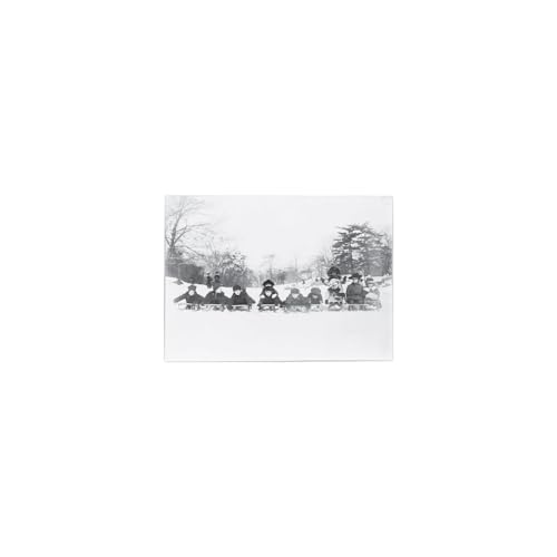 Black and white photo of a group of people in a snowy landscape.