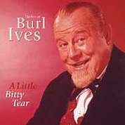 Burl Ives smiling portrait on a red album cover.