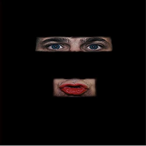Eyes and red lips framed in dark rectangles on a black background.