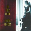 CD cover for Leslie Tucker’s “In This Room” featuring a woman with a guitar.