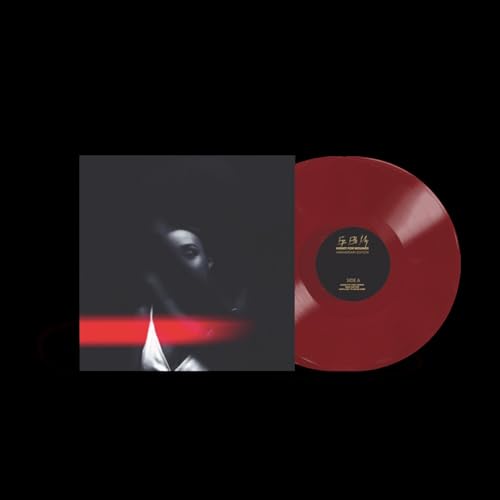 Ego Ella May Honey For Wounds album cover next to a dark red vinyl record.