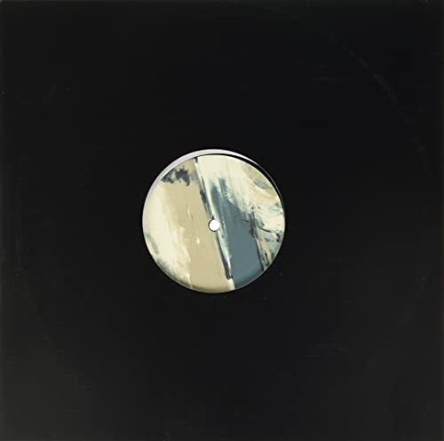 Black vinyl record with abstract white and grey painted label.